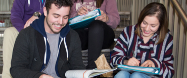 Students sitting on stairs.