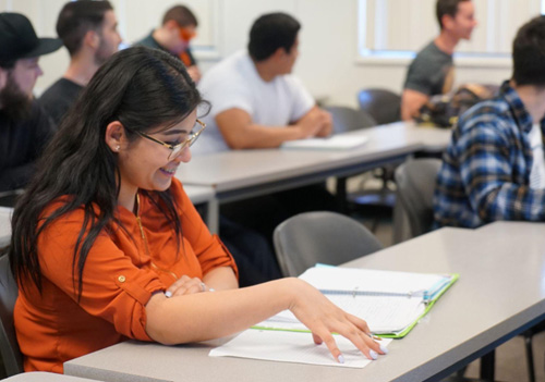 Student sitting at desk.