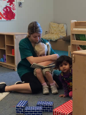 Teacher reading to child.
