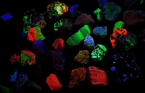 Fluorescent rocks glowing under ultraviolet light.