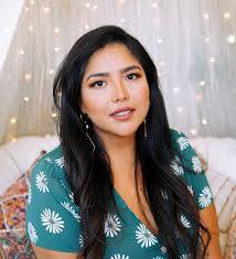 Julissa Arce, a Latina woman with long dark hair 