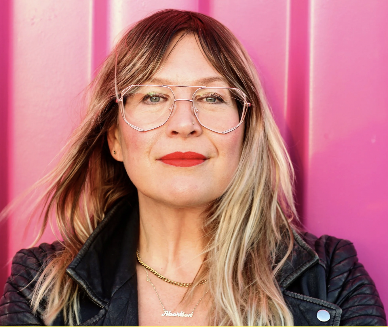 Kate Schatz, a woman with long blonde hair and glasses